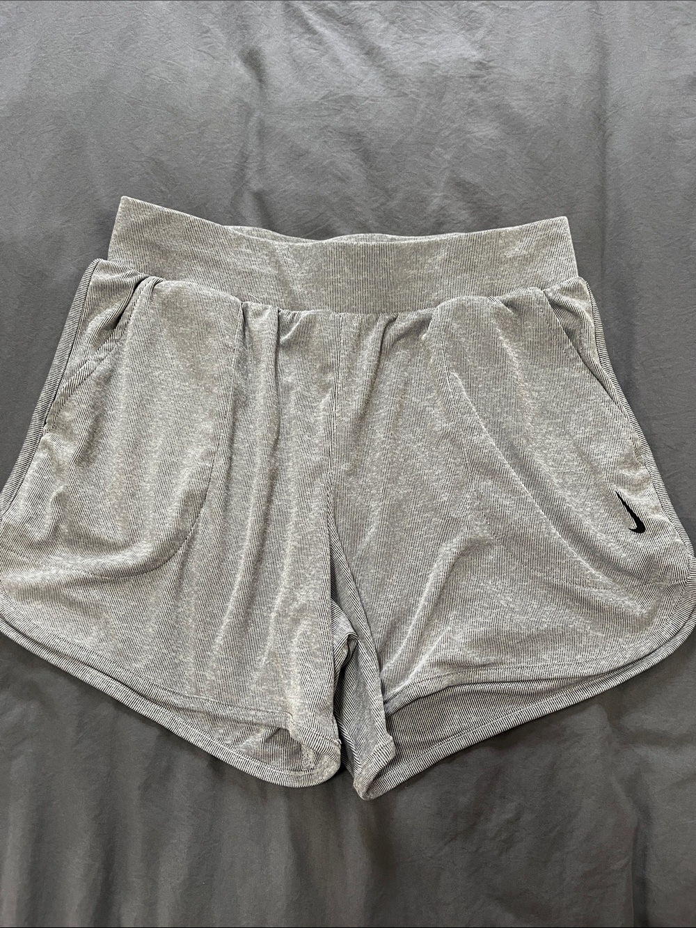 Nike Women’s Light Gray Striped Athletic Shorts with Black Swoosh